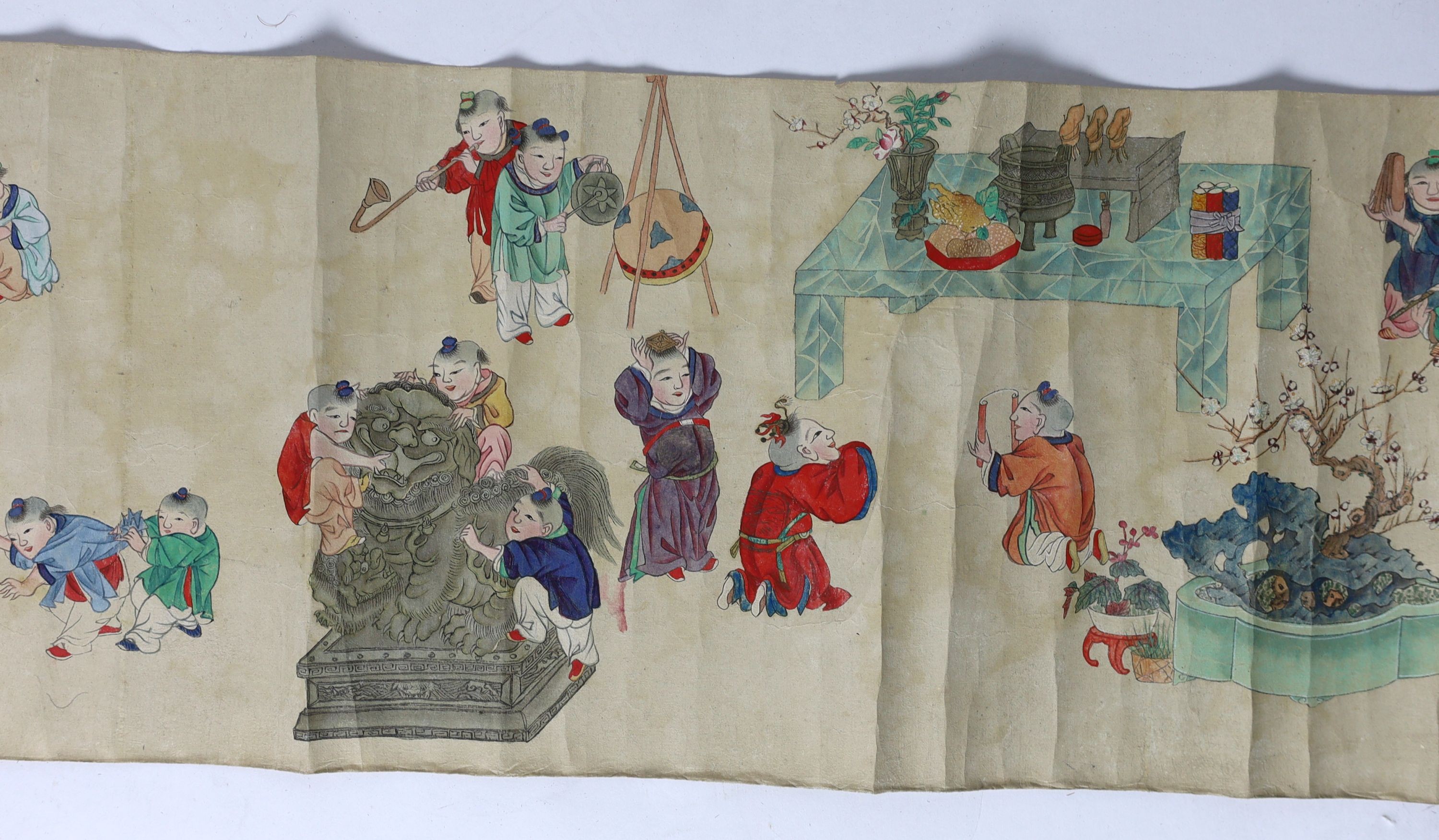 A Chinese handscroll painting on paper of ‘Hundred boys’ in a garden, late Qing dynasty, image 570cm x 26cm